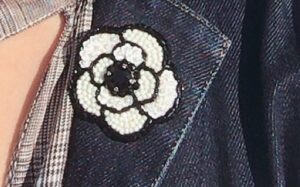 white flower brooch
